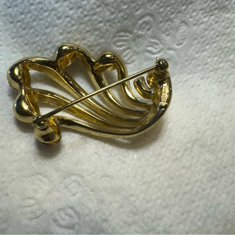 Elegant Gold and Red Gemstone Brooch